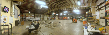 Picture of the NMRT Warehouse showing responders, supplies and equipment