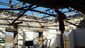 Damaged roof on the second floor of the hospital.